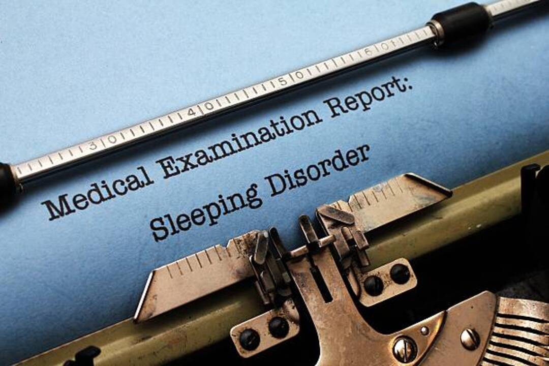 Medical report on sleeping disorder typed on blue paper