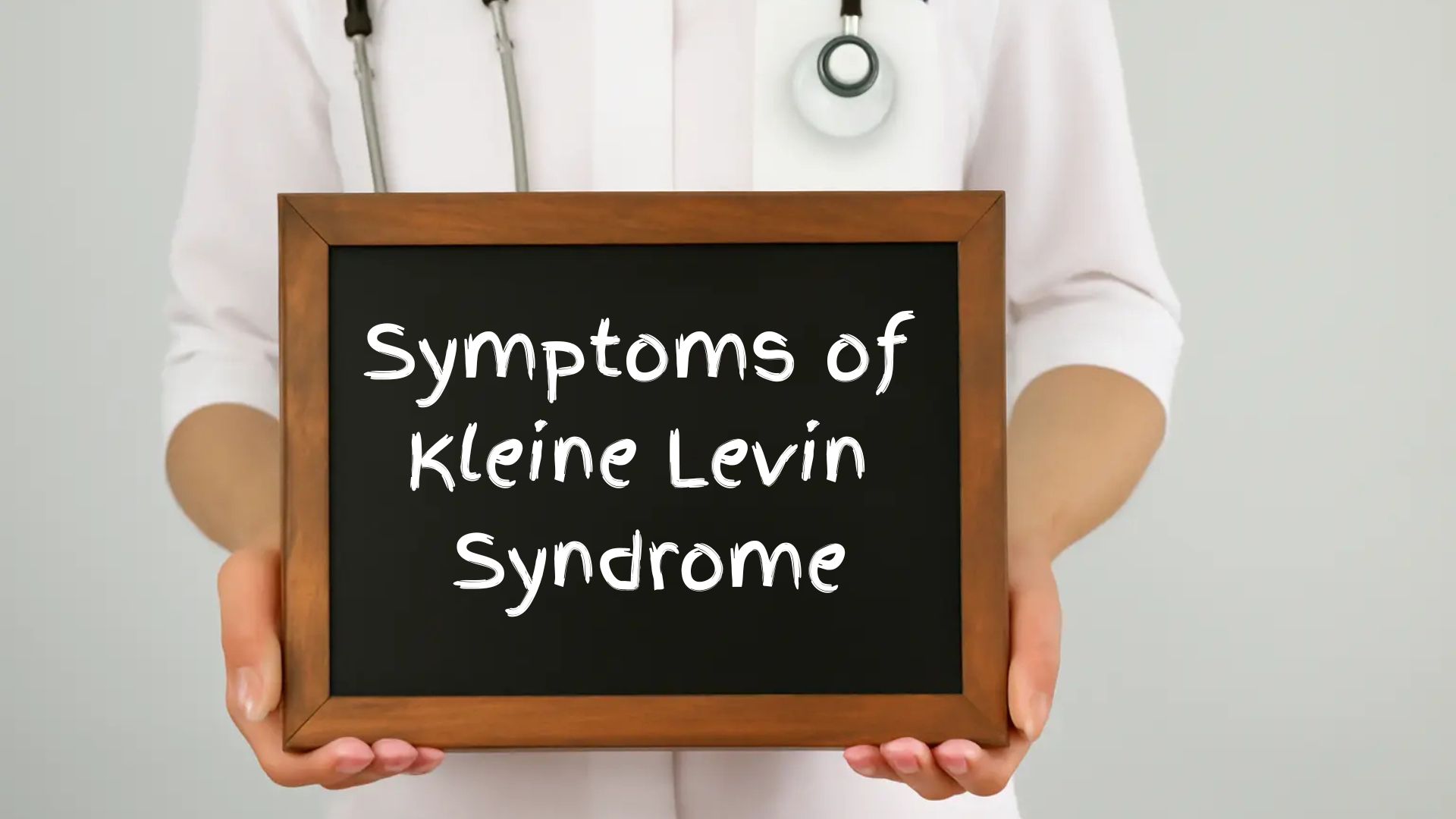 Doctor holding a sign displaying symptoms of Kleine Levin.