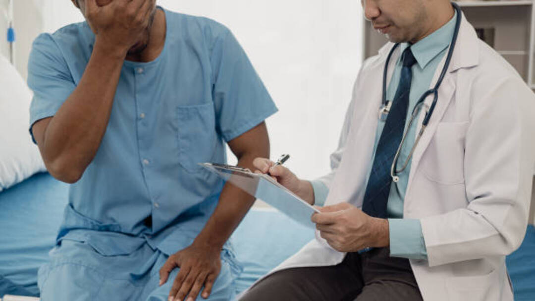 Doctor consulting patient about loud snoring treatment.