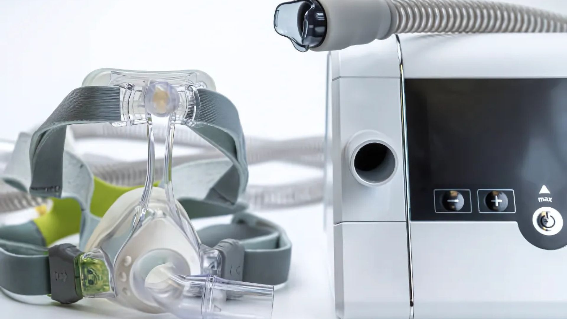 Close-up of CPAP mask and machine used for sleep apnea therapy.