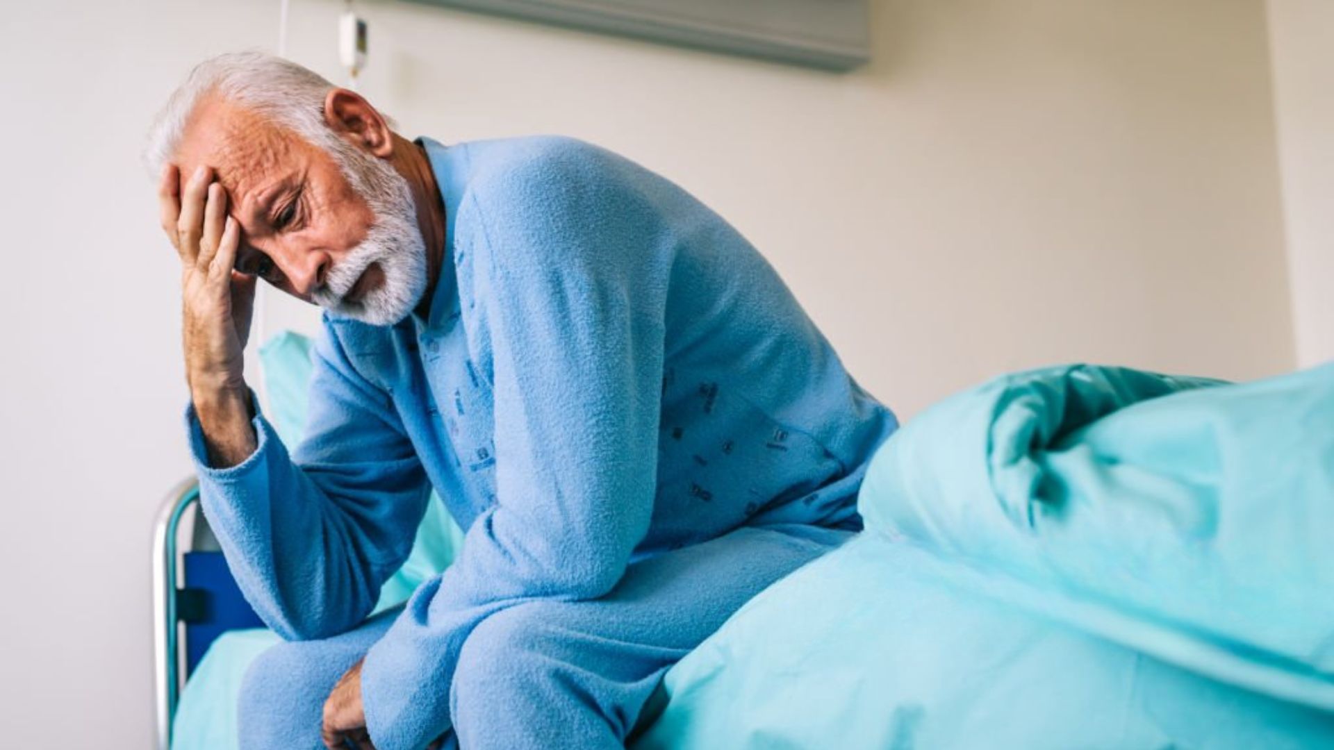 Older man tired in bed showing effects of poor immune health