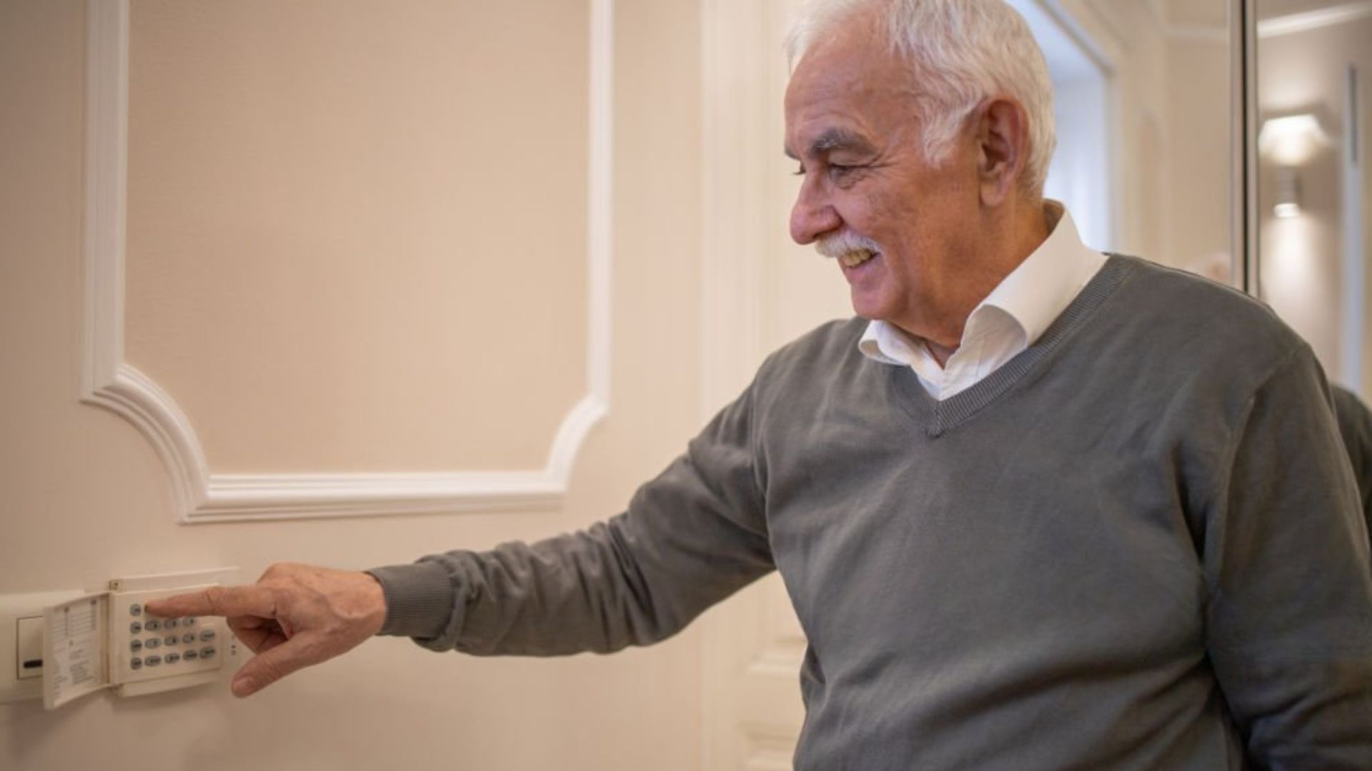 Adjusting thermostat to keep bedroom cool for sleep nightly.