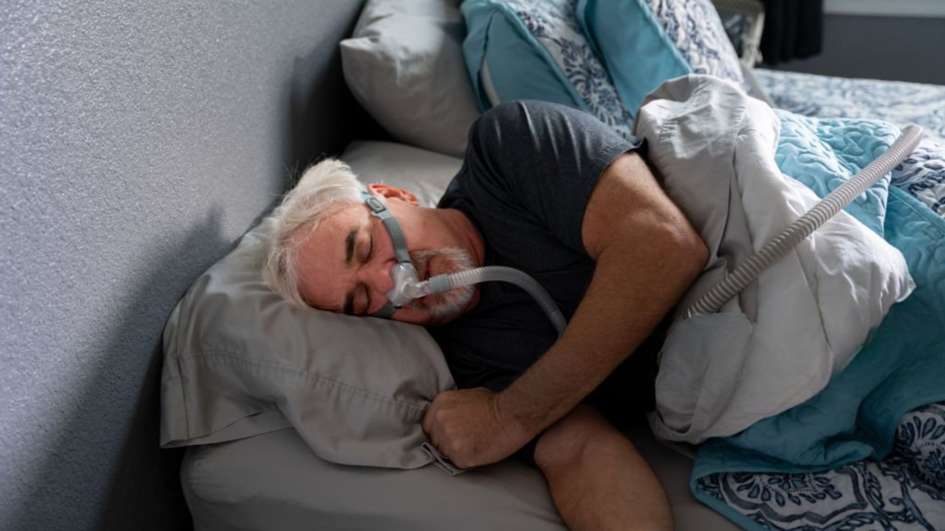 Senior using CPAP mask while taking a short nap