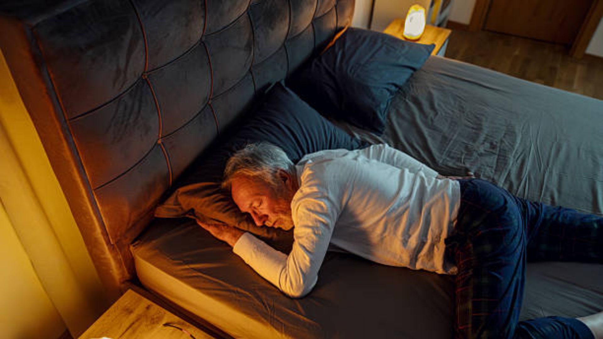 Senior sleeping on side to help reduce sleep apnea signs
